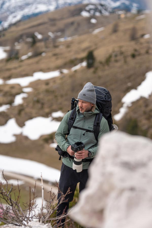 Gürel with camera and backpack